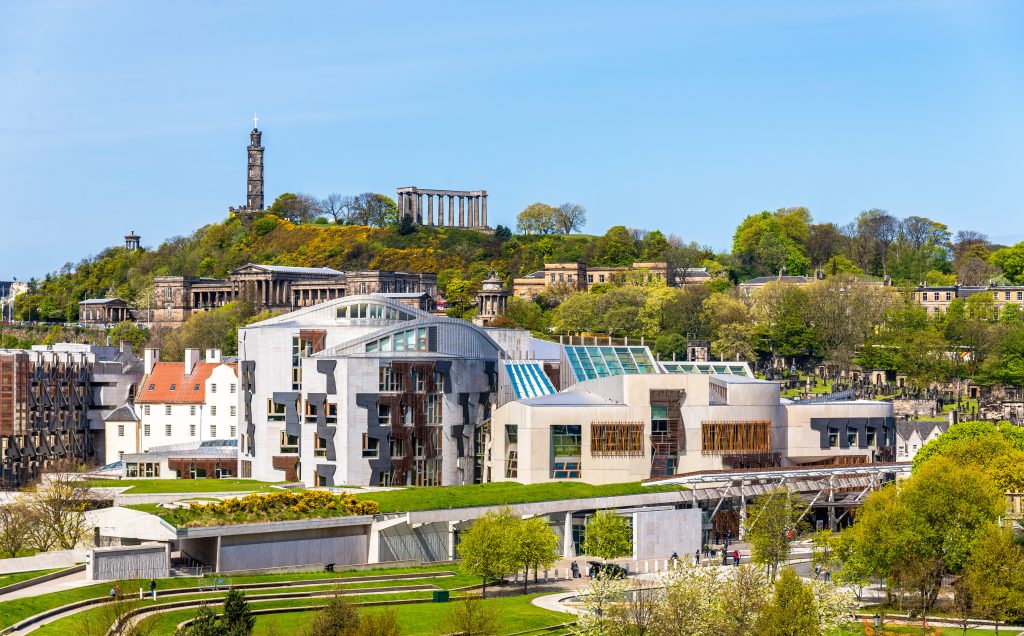 View of Edinburgh skyline including the Scottish Parliament and Calton Hill monuments